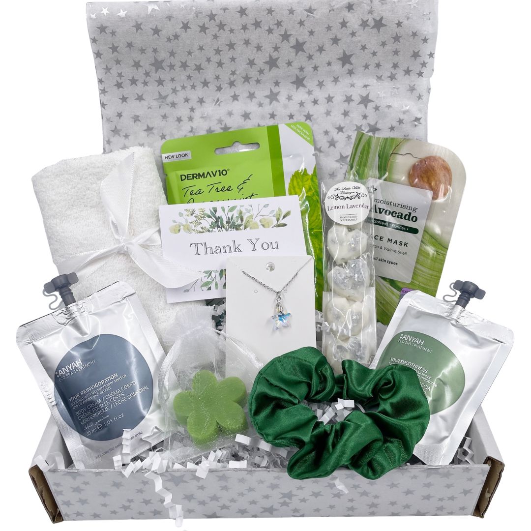 Gift basket with skincare products, a scrunchie, wax melts, face towel and a necklace oin a white box with card of your choice.